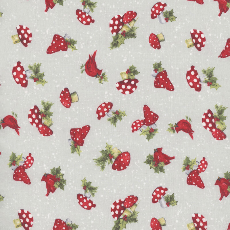 Gray fabric with small white dots all over and tossed mushrooms, cardinals, and holly leaves