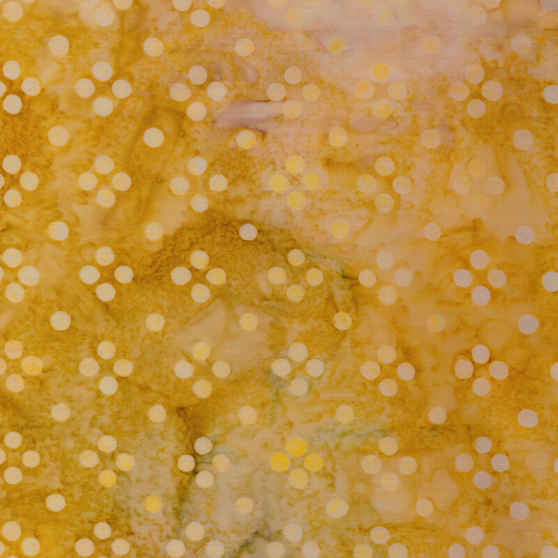 Mottled ochre fabric with pale clusters of tonal dots in rows