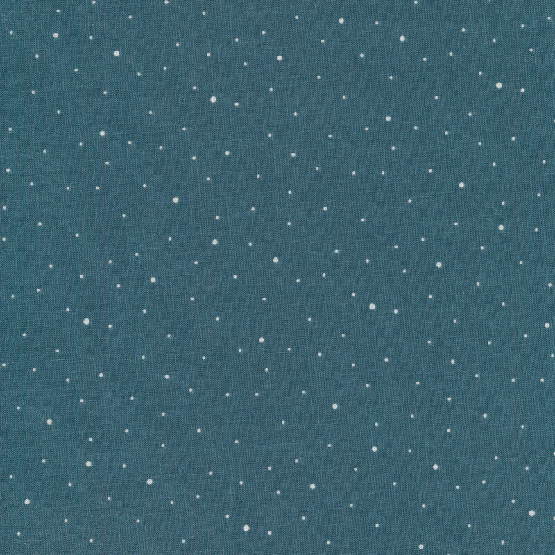 white ditzy spots on a denim blue fabric