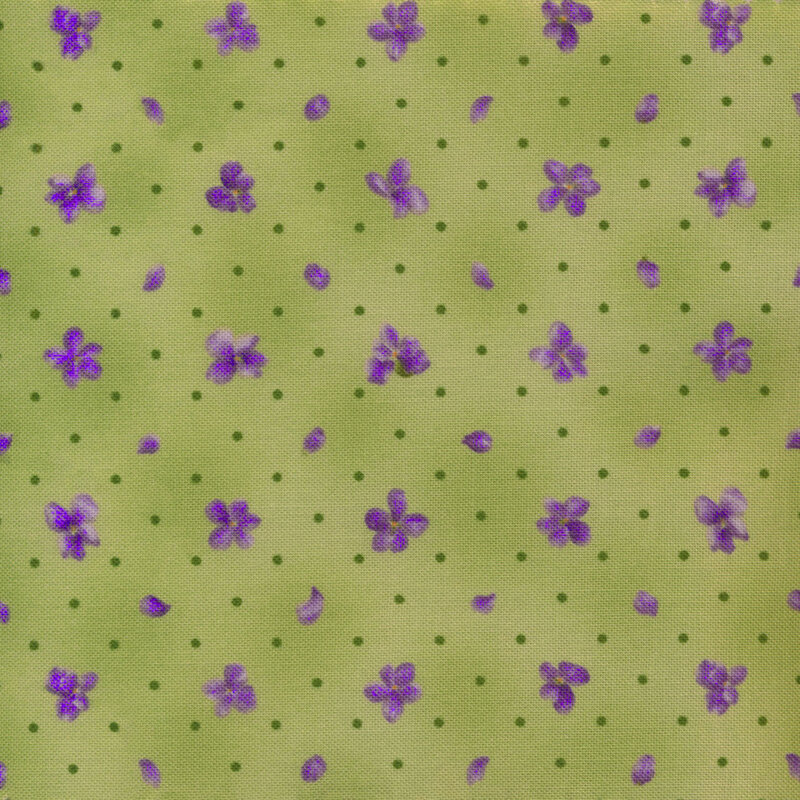 Scan of fabric featuring small purple flowers and polka dots on a light green background
