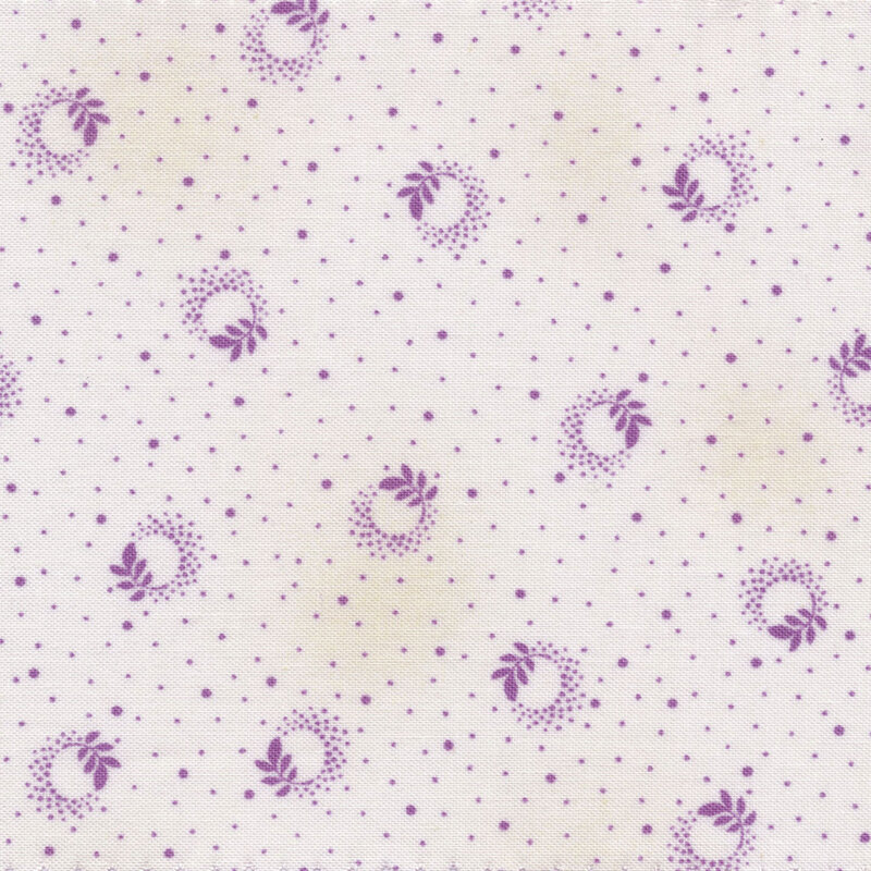 Scan of fabric featuring purple ditzy spots on a white background with branch leaf designs