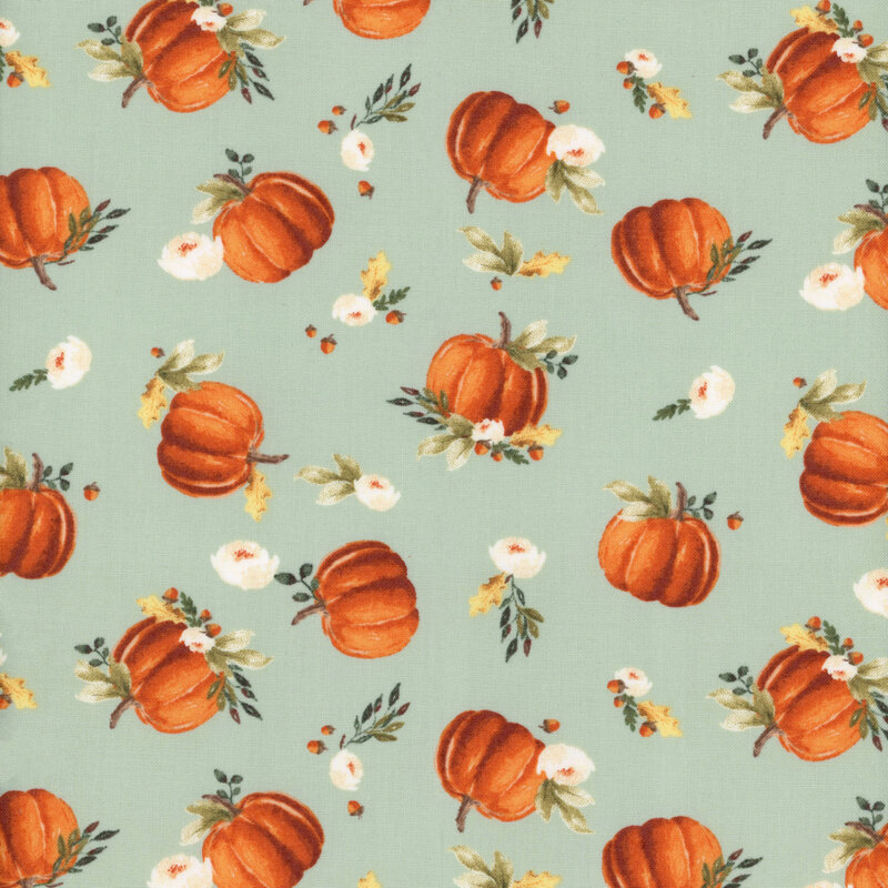 fabric featuring tossed pumpkins and white flowers on a light mint background