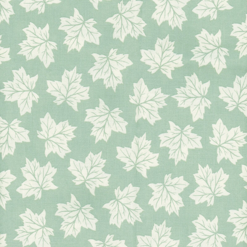 fabric featuring tossed off white maple leaves on a light mint background