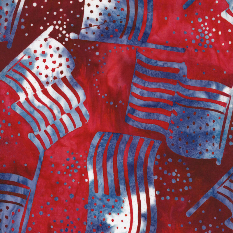 red mottled fabric with blue and white mottled American flags tossed in the foreground