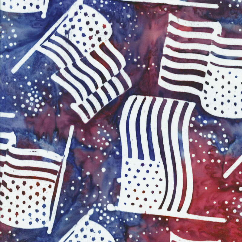 red and blue mottled fabric with white American flags and dots tossed in the foreground