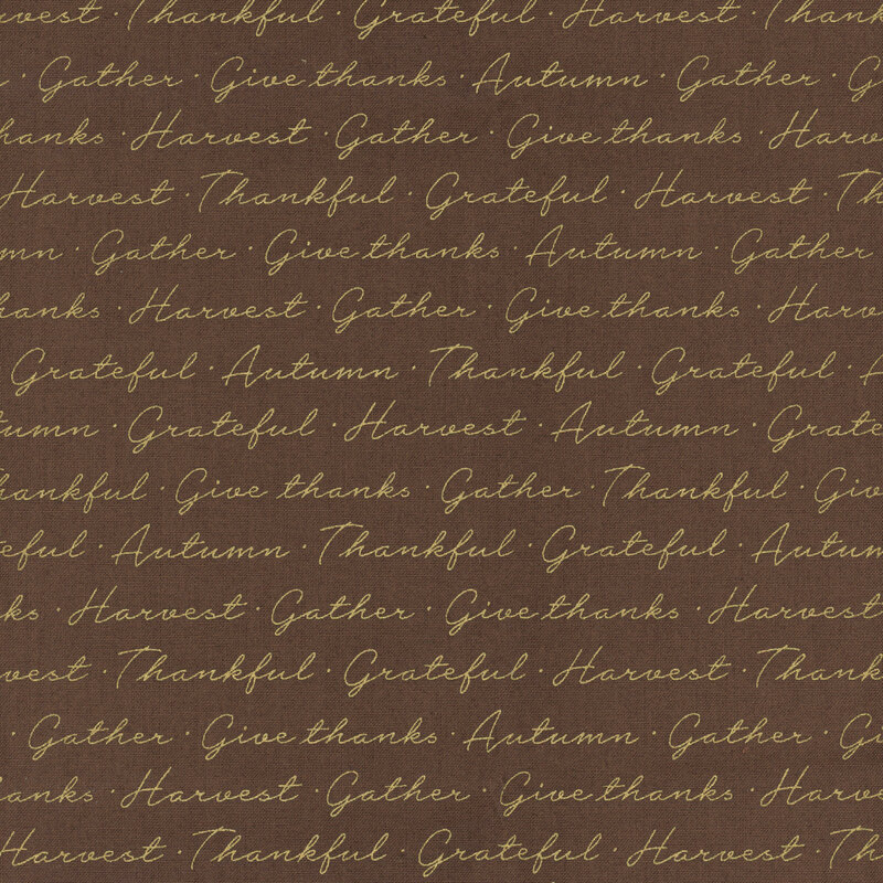 Solid brown fabric with metallic gold cursive writing