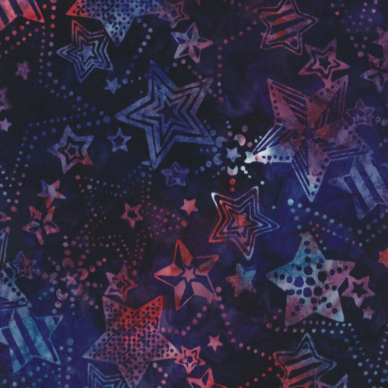 navy blue mottled fabric with mottled red, white, and blue stars in different styles and patterns all over