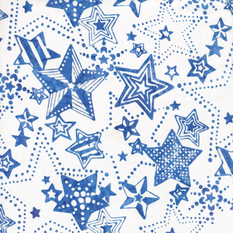 white fabric with mottled blue stars in different styles and patterns all over