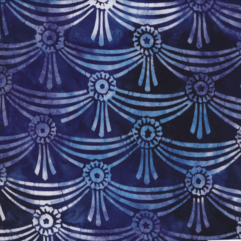 blue mottled fabric with blue and white mottled ribbons draped together in rows