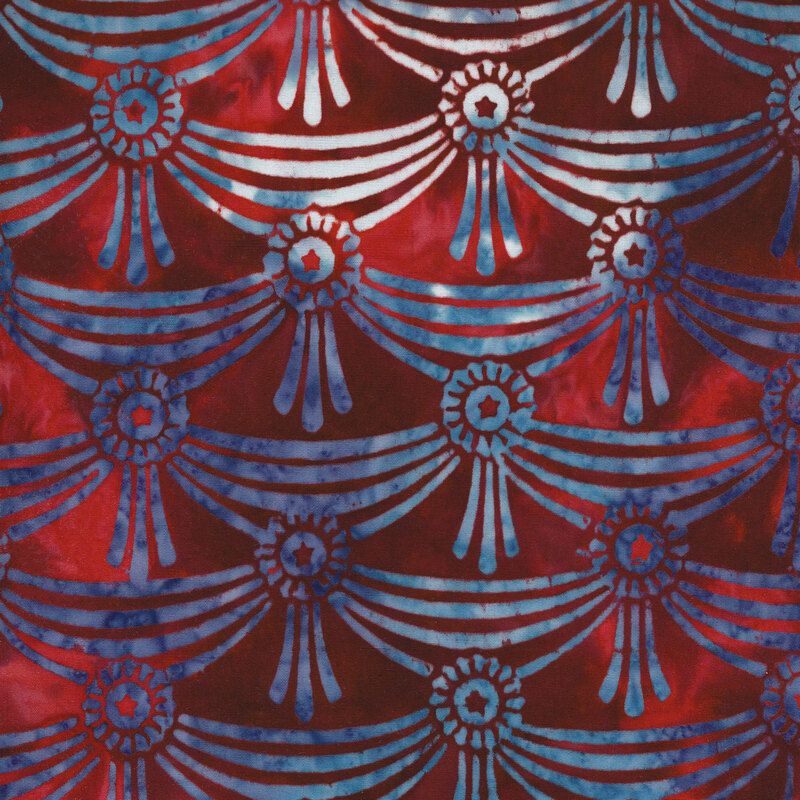 red mottled fabric with blue and white mottled ribbons draped together in rows