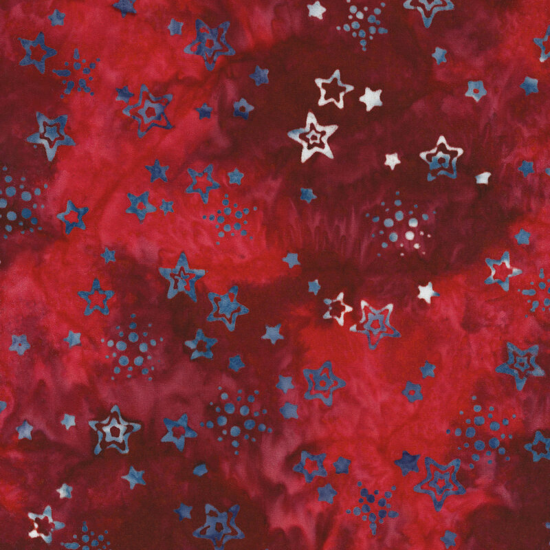 mottled red fabric with small light blue and white mottled tossed stars