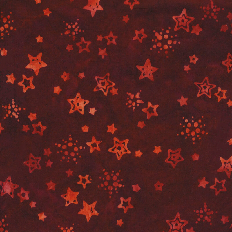 mottled dark red fabric with small tonal tossed stars