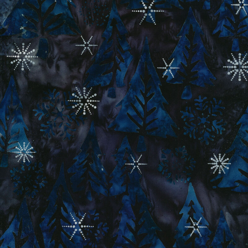 Black and dark blue marbled batik fabric with large pine trees and snowflakes with silver metallic accents