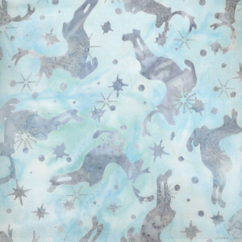 Deep navy blue fabric with light blue jumping caribou and snowflakes and silver metallic accents