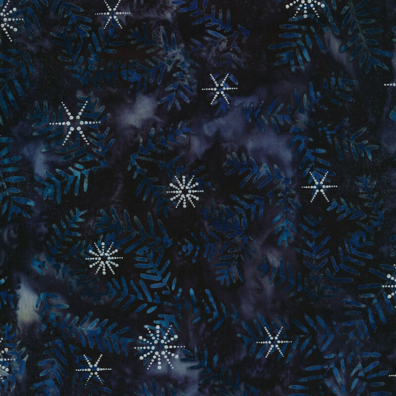 Dark black and purple marbled batik fabric with blue pine sprigs and silver metallic accents