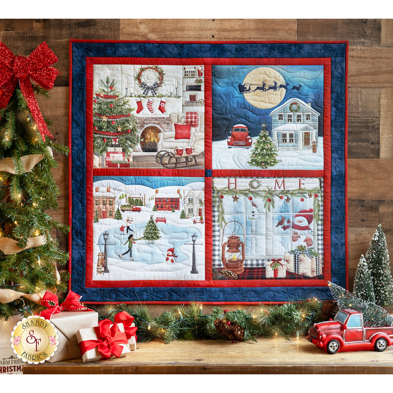 Wall hanging with 4 different winter and Christmas scenes including a fireplace, ice skating, Santa flying over a house, and a gift filled window.