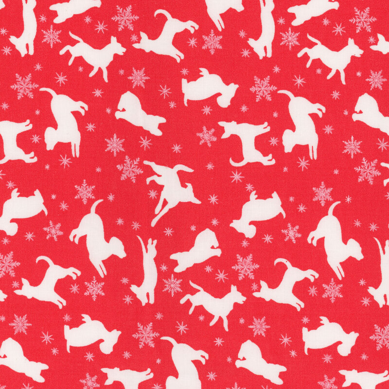 Solid red fabric with white silhouettes of playing dogs, snowflakes, and stars