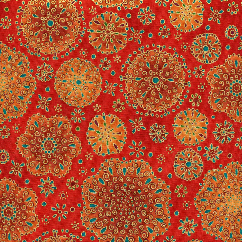 bright red fabric with ornate flower shapes in varying sizes and shades of orange with gold and teal accents