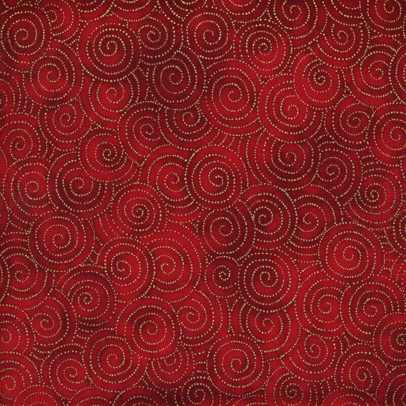 Mottled bright red fabric with circular swirls made up of tiny gold dots