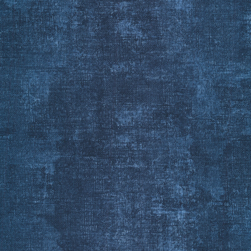 Dark denim blue mottled fabric features dry brush texture