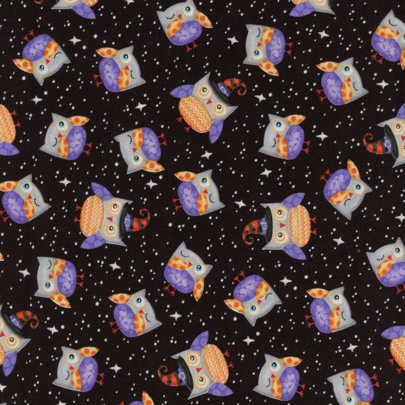 Solid black fabric with tossed owls wearing witch hats