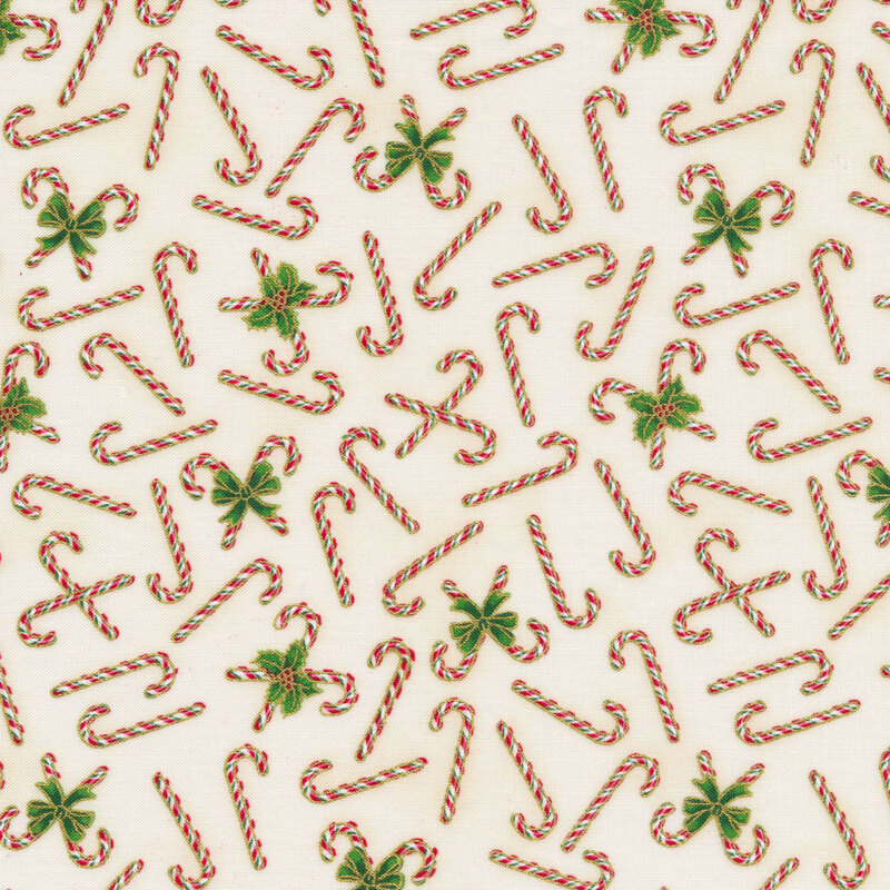 Ivory fabric with featuring candy canes and small holly leaves with gold metallic accents