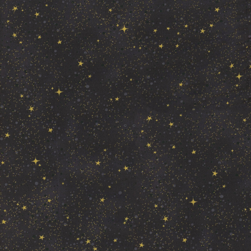 fabric featuring dark gray mottled background with gold stars and dots