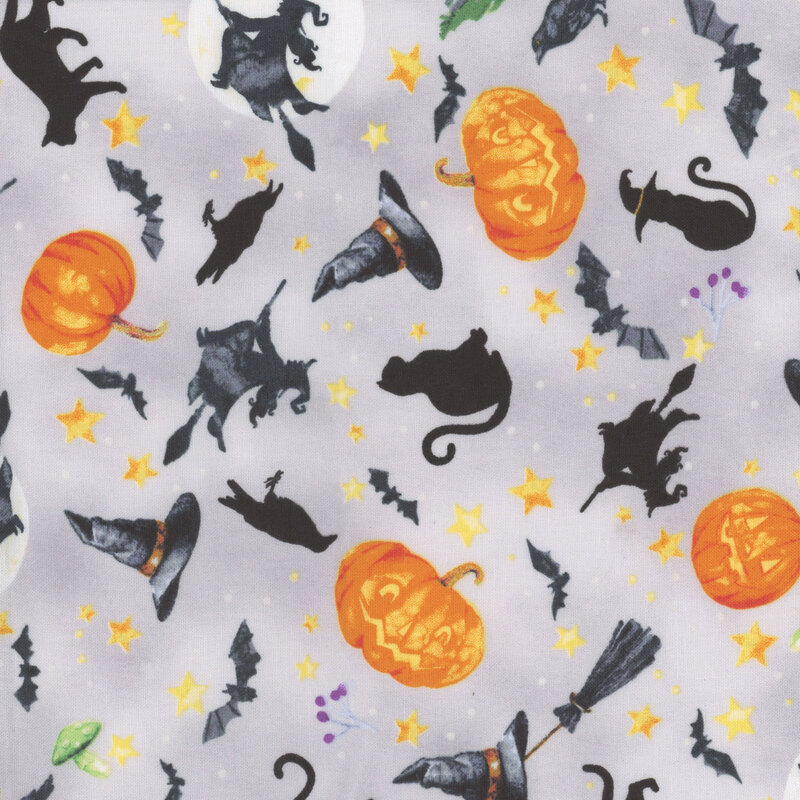 fabric featuring cats, crows, bats and pumpkins on a gray background with golden stars