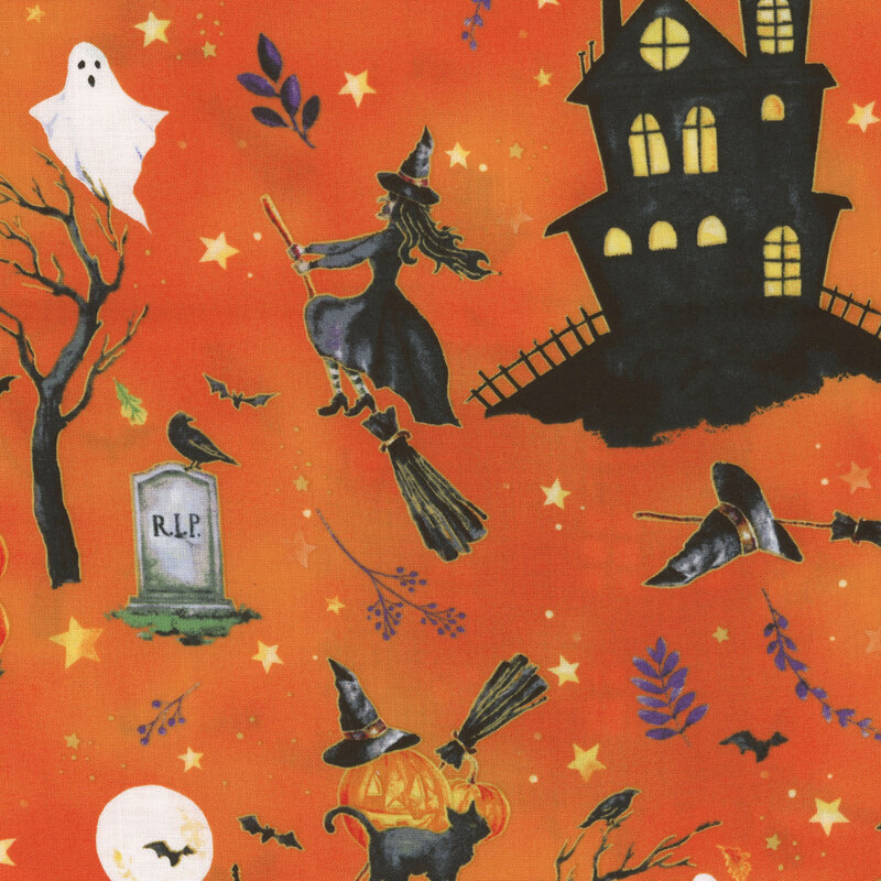 fabric featuring haunted houses, witches and ghosts print on an orange background