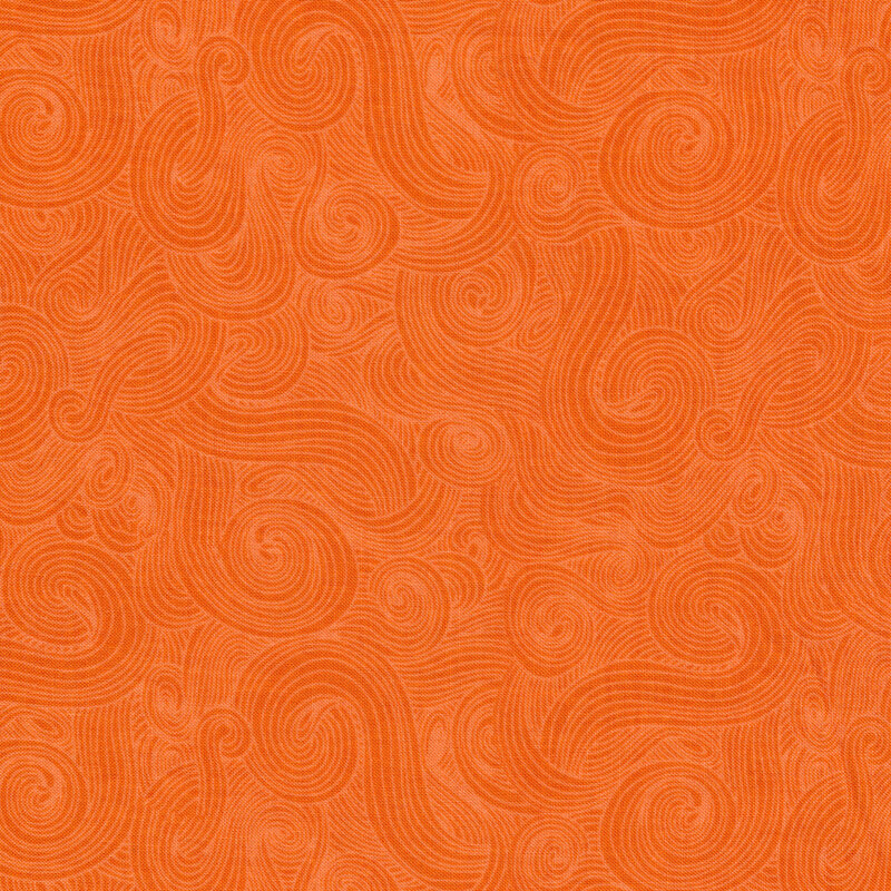 Tonal orange fabric with dark swirls on a lighter background 