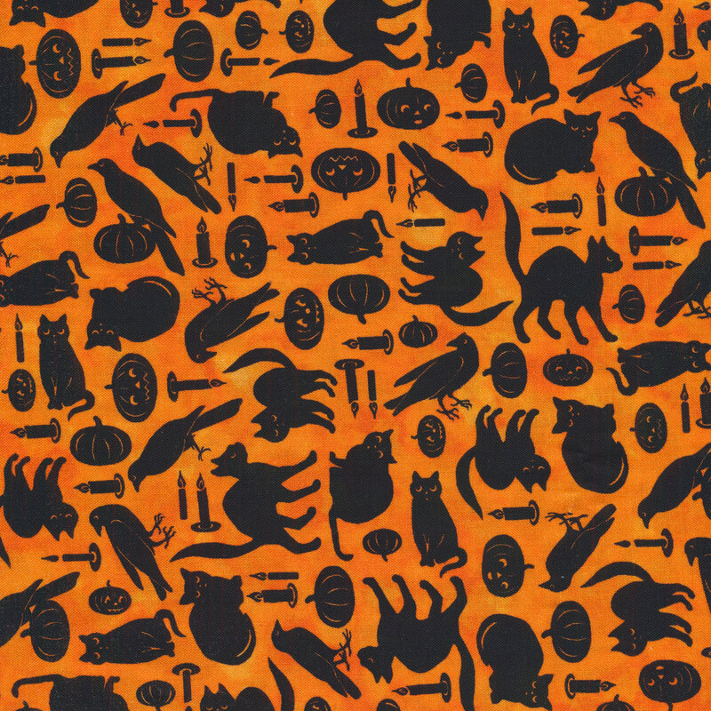 Bright orange fabric with black cats, ravens and jack-o-lanterns