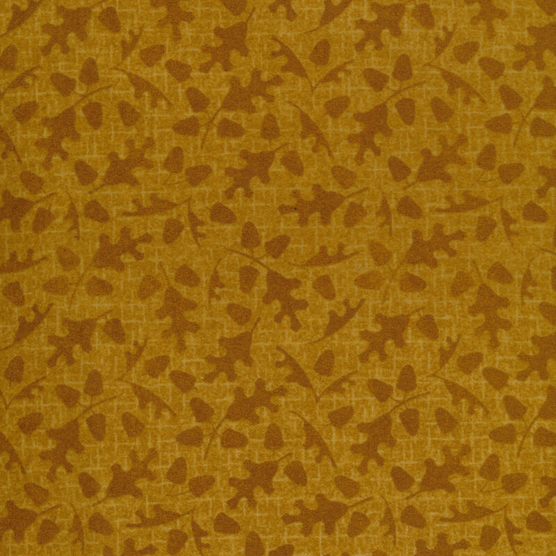 tonal gold fabric with fall leaves and acorns on a golden yellow background