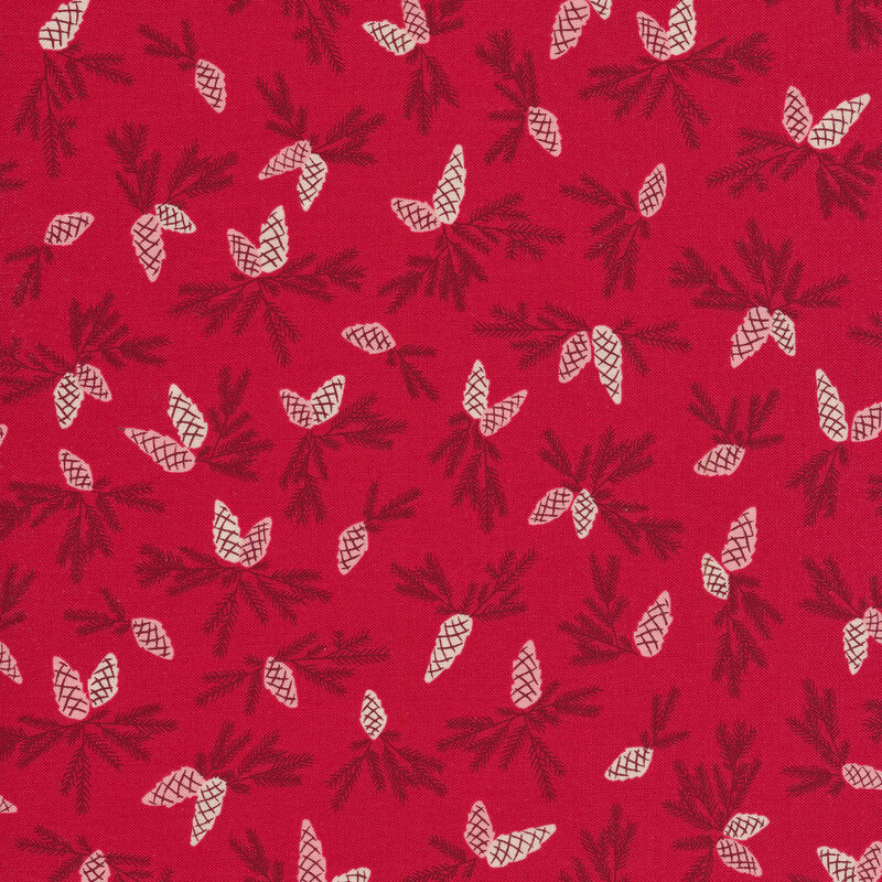 Red fabric with tossed pine cone sprigs all over