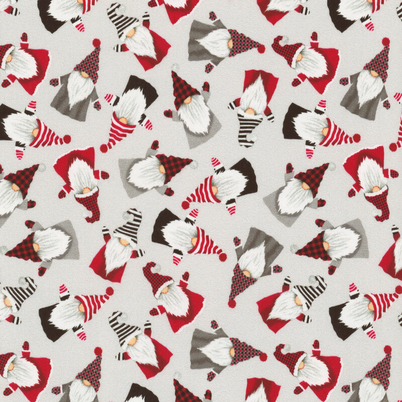 fabric featuring ditzy tossed gnomes in red and gray on a cream background