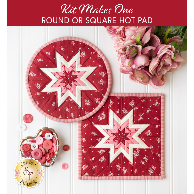Round and square folded star hot pads made with red and pink floral fabrics on a white countertop with a bouquet of pink roses nearby and a heart shaped dish full of pink and red buttons