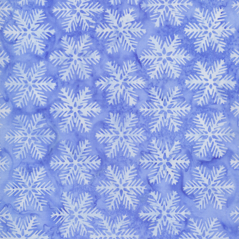 Medium blue mottled fabric with pale blue snowflakes all over