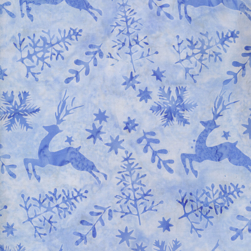 light blue mottled fabric with medium blue silhouettes of trees, deer, stars, and snowflakes