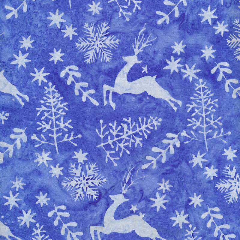 medium blue mottled fabric with light blue silhouettes of trees, deer, stars, and snowflakes