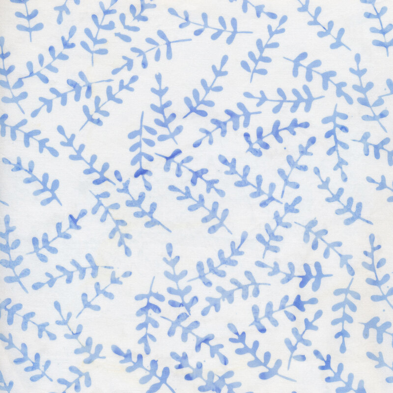 White fabric with pale blue leafy branches all over