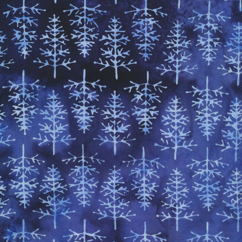 Dark and medium blue fabric with pale blue evergreen trees all over