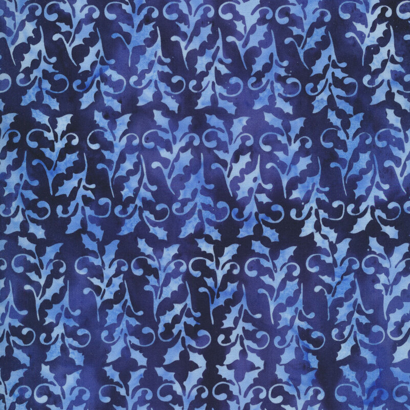 dark and medium blue mottled fabric with light holly leaves and small swirls all over
