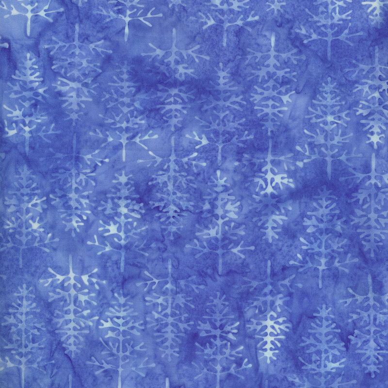 medium blue fabric with mottled pale blue evergreen trees all over