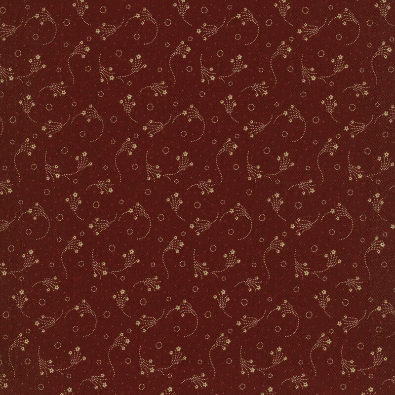 Red fabric with small beige flowers swirling across it