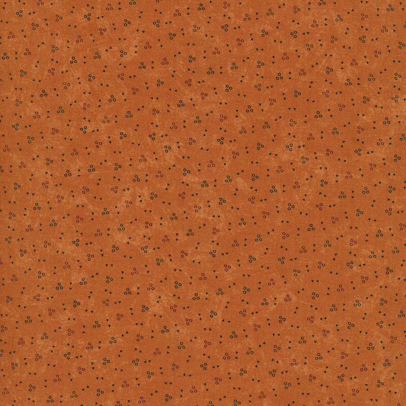 rich earthy orange background covered in multicolor dots and triangles