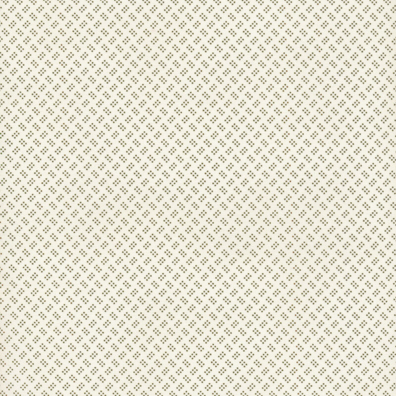 This cream fabric features clusters of six tiny green dots alternating in direction for an overall textured look