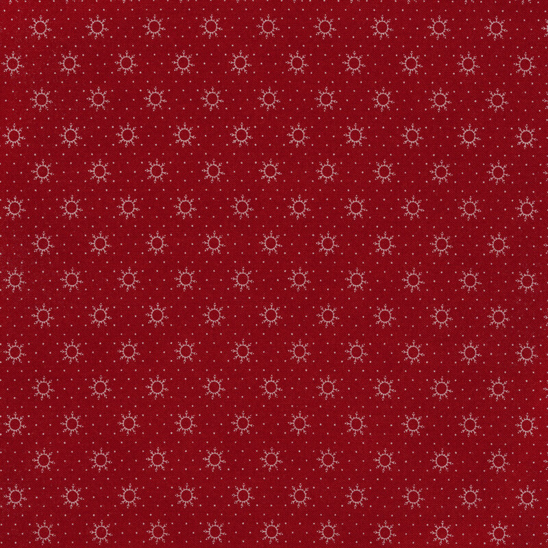 bright white dots and snowflakes on a maroon background