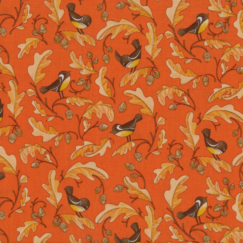 Bright orange fabric with light orange leaves, acorns, and small black and yellow birds on it