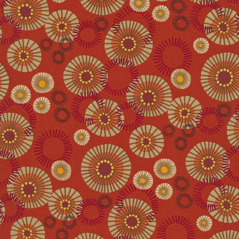 Bright orange fabric with abstract orange, tan, and pink circles of varying sizes