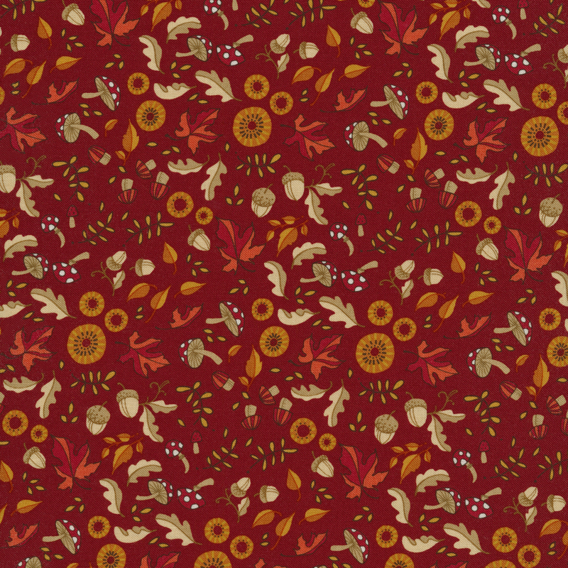 Bright fuchsia fabric with red maple leaves, mushrooms, acorns, flowers and other fun motifs