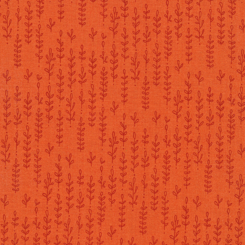 Bright orange fabric with a darker tonal pattern